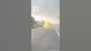 What the DUCK?! Giant Inflatable Duck Bounces Across Road