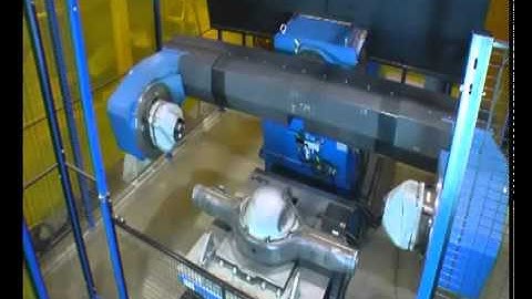 Motoman robot welding a heavy truck rear axle