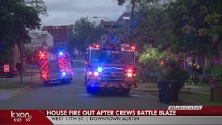 Crews battle two-story house fire in Downtown Austin