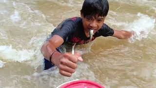 primitive way of hunting and catching fish in large rivers