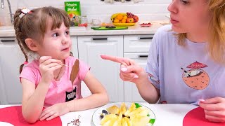 Eva and mom play edible and inedible chocolate stuff. Candy toys for kids