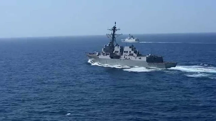 USS Sterett (DDG 104) and Chinese frigate steaming...