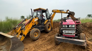 Old Jcb 3dx Backhoe Loader Machine Loading Mud in Mahindra Yuvo 475 Di and Mahindra 265 Di Tractor