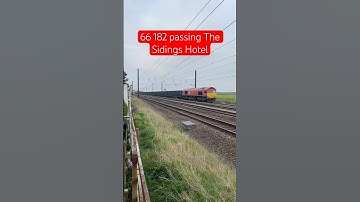 DB Cargo Class 66 passing The Sidings Hotel