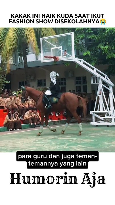 THIS BROTHER RIDES A HORSE DURING A FASHION SHOW AT HER SCHOOL