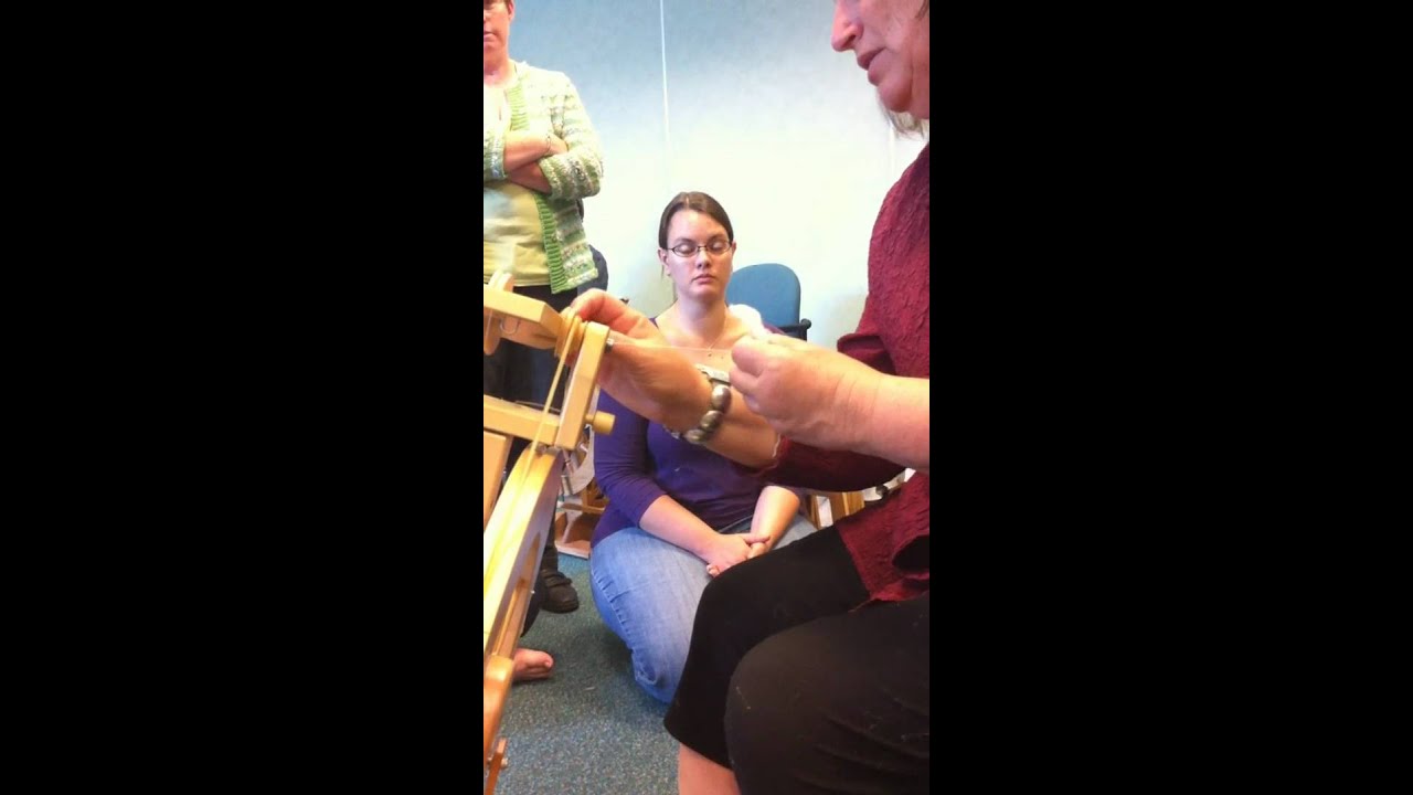 Judith Mackenzie spinning cotton from a seed