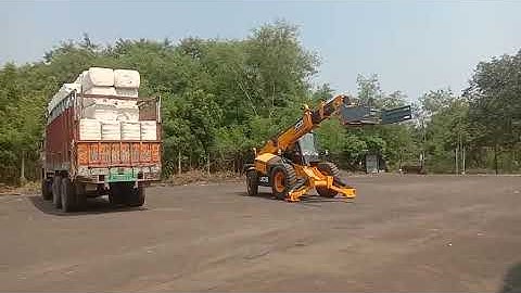 JCB 530-110 Telehandler - Unloading Bales, Packs and Cartons with a Block Handler