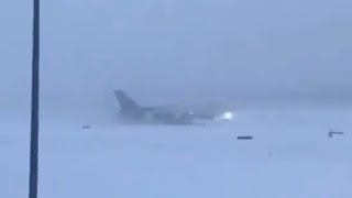 A Boeing 747 Jet Struggles To Take Off In A Snow Storm