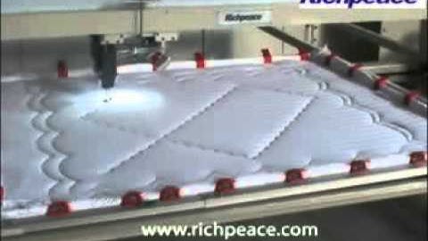 computerized single head quilting machine working