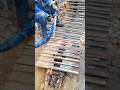 REPLACING BLADES ON EXCAVATOR'S TRACK CHAIN AND SHOE LINK IN MANUFACTURING WORKSHOP