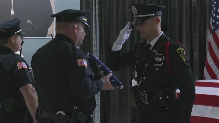 Officials present flag to fallen Officer Seara Bur...