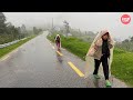 Cold windy and rainy day walk through mountain village