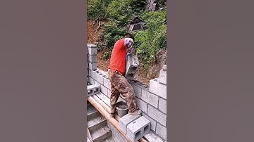 The Process of Laying Concrete Blocks on a Wall