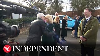 Paul O'Grady greets Camilla with a kiss at Battersea Dogs and Cats Home