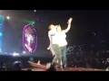 Fan jumps on stage to dance with Chris Martin