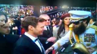 VIDEO Sacha Baron Cohen spills Kim Jong Il ashes on Ryan Seacrest ACADEMY AWARDS RED CARPET