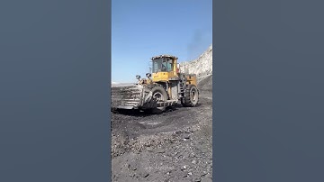 Wheel Dozer: wheel dozer clearing coal face.  #beast #excavator #miningindustry #miningmachinery