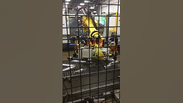 Robotic Loading of Vehicle Assembly Parts onto Conveyor