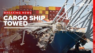 Massive cargo ship towed from Key Bridge wreckage site