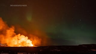 AP EXCLUSIVE Iceland volcano erupts amidst Northern Lights display