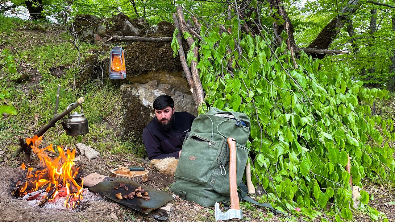 Solo Bushcraft Camping Under the Rock! Cooking Lamb on a Stone ...