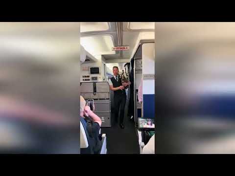Amazing video sees plane passengers serenaded by cabin crew playing bagpipes during flight