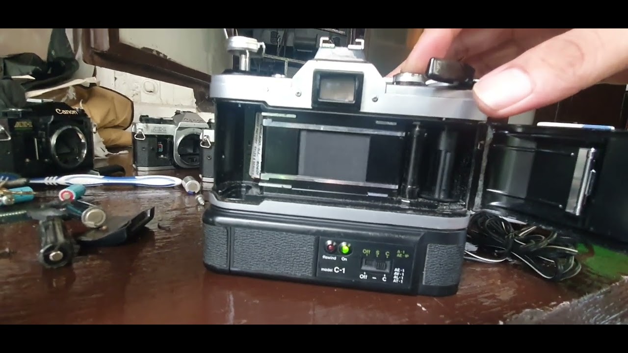 Canon A-1 + FD 1,8/50mm + Power Winder A avec boite et mode d'emploi