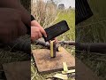 chopping purple sugar cane on wooden board in field