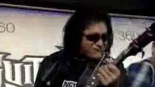 Gene Simmons rocking out at the Guitar Hero championships chords
