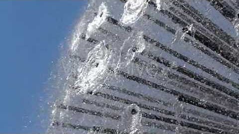 the Fountain Work in Slow Motion. Frame Closeup. Water Spray Scatter in Different Directions.