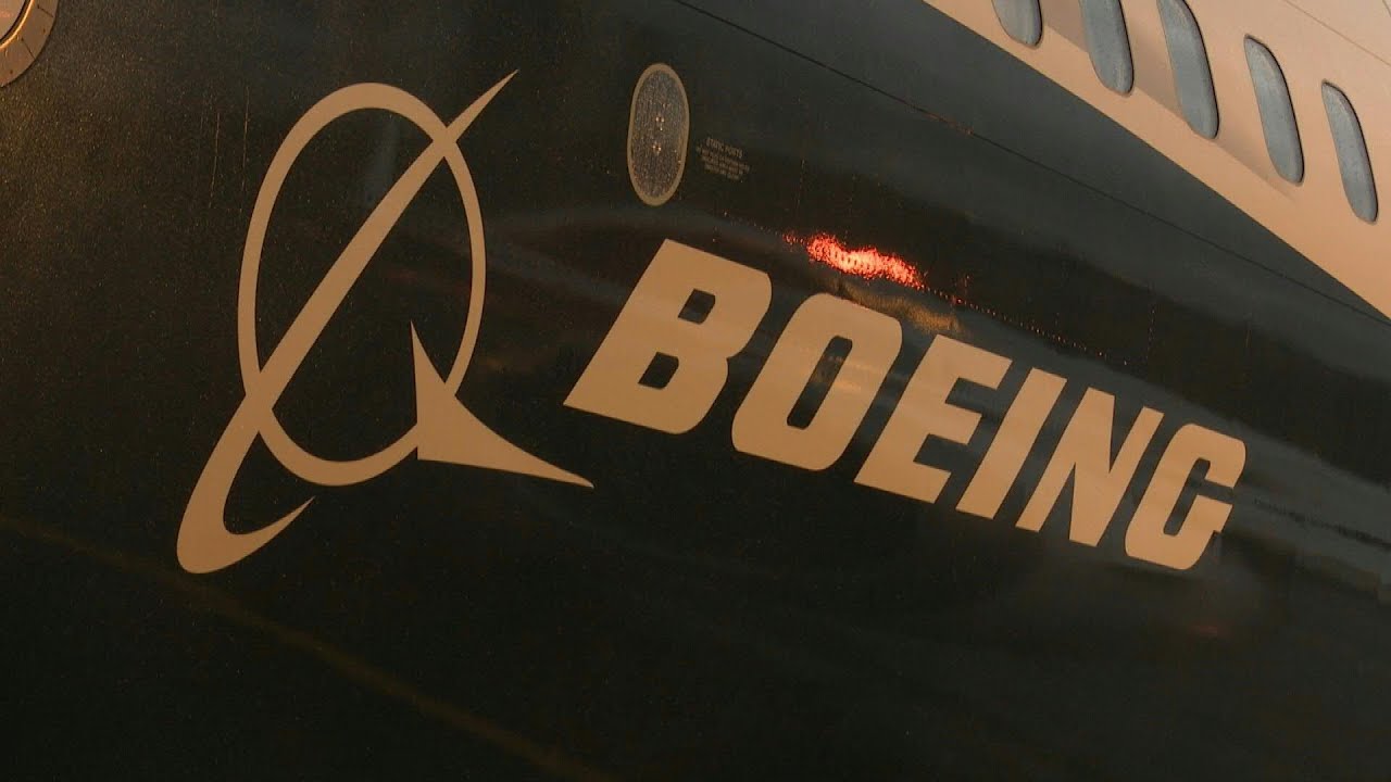 Boeing says to halt 737 MAX production next month | AFP - YouTube