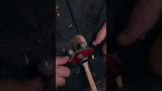 Μaking a spoon out  of olive wood on the lathe.