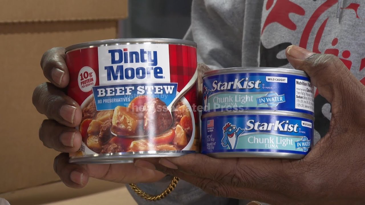 Cars wait in line for food and water donations before the storm hits Atlanta