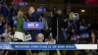 Protesters storm stage as Joe Biden speaks