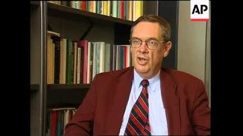 Newspaper headlines, street scenes, analyst