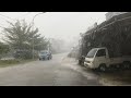 Walking in heavy rain and strong wind storm  indonesian village traditional market area