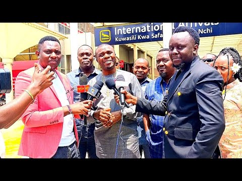 TAZAMA ALIVYO POKELEWA MCHUNGAJI BONIFACE MWAMPOSA JKIA NAIROBI KENYA TAZAMA ALIVYO POKELEWA MCHUNGAJI BONIFACE MWAMPOSA JKIA NAIROBI KENYA