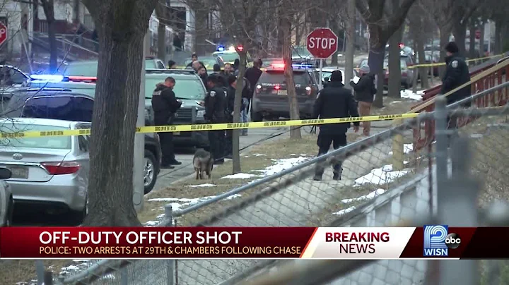 Police arrest two people in connection with officer shooting