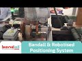 Bandall with robotised positioning system