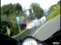 Motorcycle wipes out on roadside in front of biker