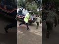 DRAMA AS A MAN DESTROY A POLICE CAR AS POLICE WATCH AND LATER ARRESTED KENYANS WAMECHOKA