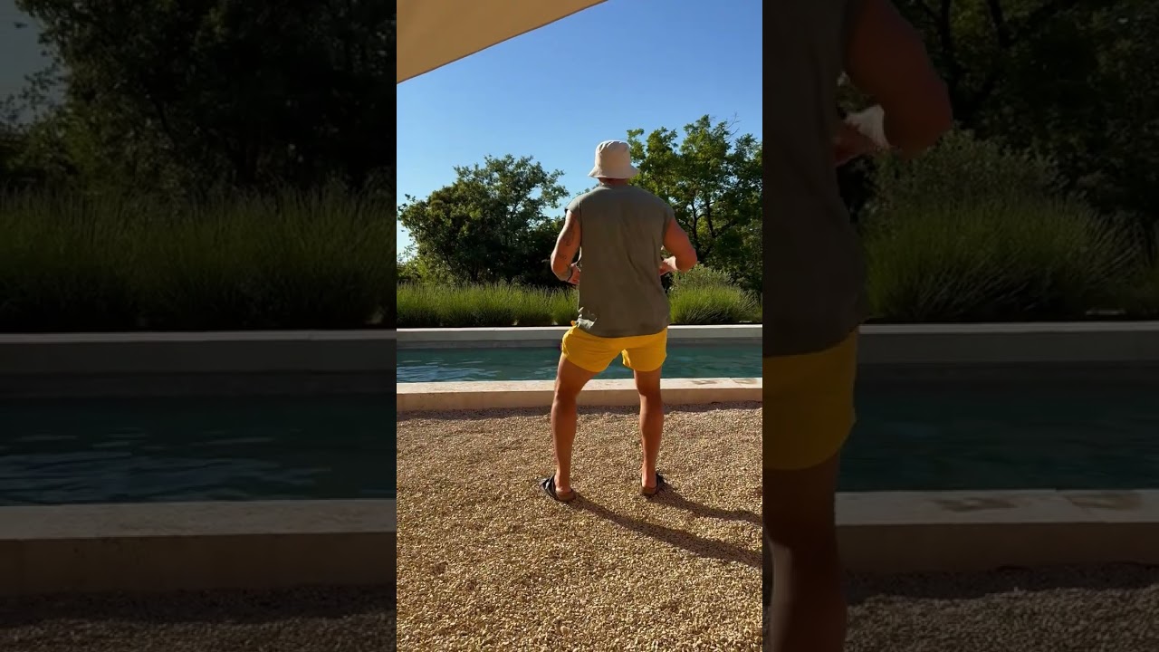 Guy dances near pool then little girl runs and accidentally bumps into his rear