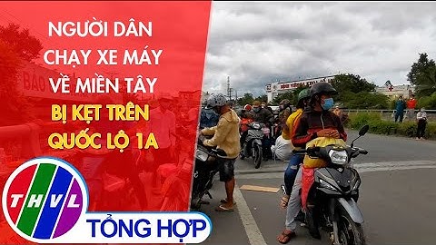 Người dân chạy xe máy về miền Tây bị kẹt trên Quốc lộ 1A