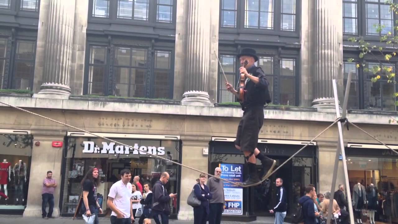 Tight Rope Playing Instruments Incredible: man plays violin on tightrope - YouTube