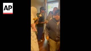 Video shows people seeking shelter in a home after Seattle shooting