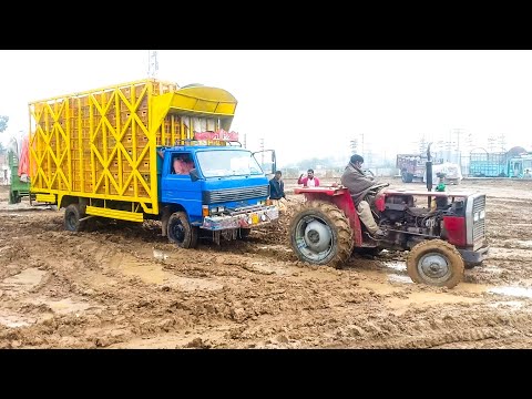 fail-3500-mazda-in-heavy-muds-get-out-by-tractor-mf-240.