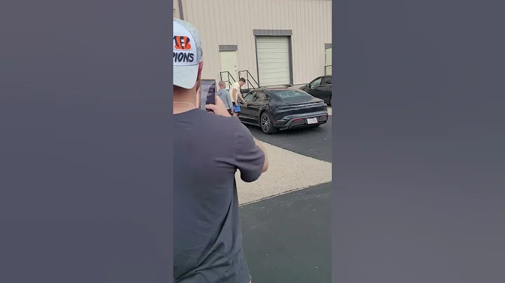 Joe Burrow leaving the signing in his Porsche