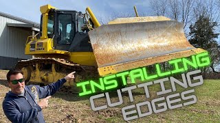 Installing cutting edges on the Komatsu D65 Dozer.