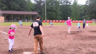 Emma (8 yrs old) playing softball