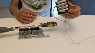 Exploring electromagnetism: A homemade railgun experiment